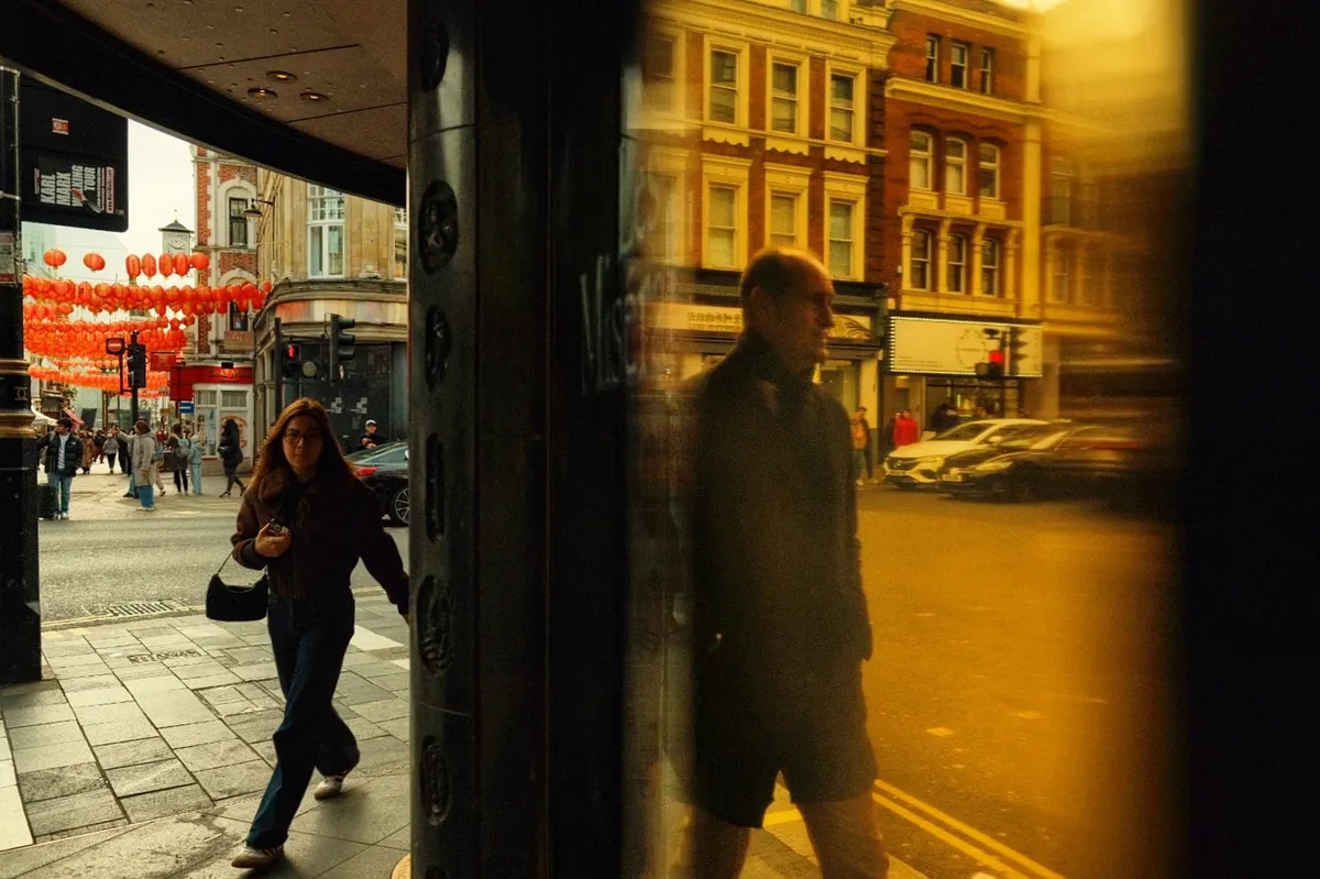 A reflection in a Chinatown shop window, London street photography