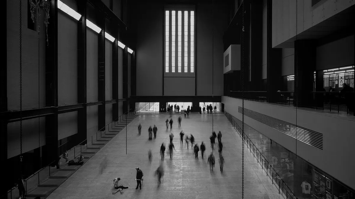 Figures blurred across the Turbine Hall at Tate Modern, London